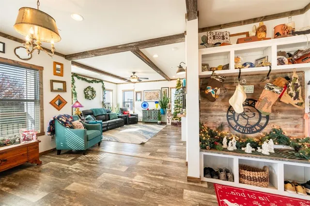 a view of living room filled with furniture and a window