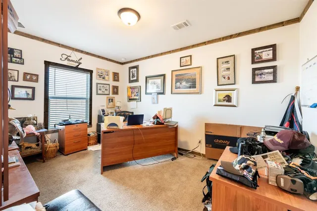 a bedroom with furniture and a wooden floor