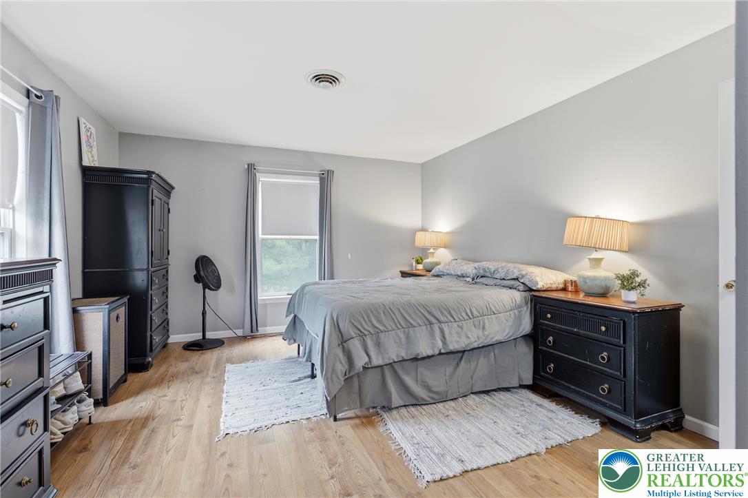 732 Bushkill Center Road Nazareth, PA 18064 - Photo 14 of 43 Natural light illuminates the light wood flooring in this serene bedroom.
