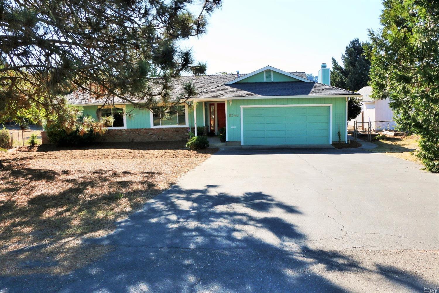 8346 Blackney Road Sebastopol, CA 95472 - Photo 1 of 1 a front view of a house with a yard and garage