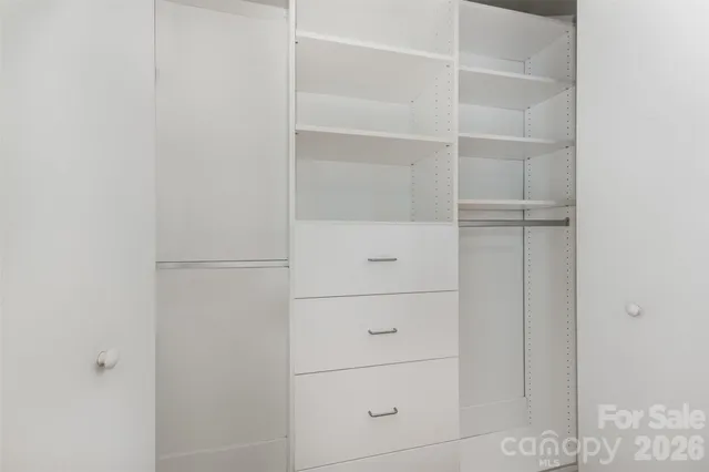 a bathroom with a sink a mirror and a lamp