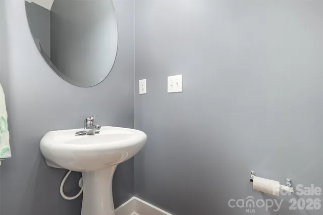 a white toilet sitting next to a small yard