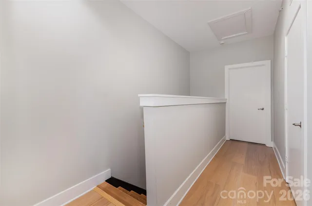 a porch with a door and chair