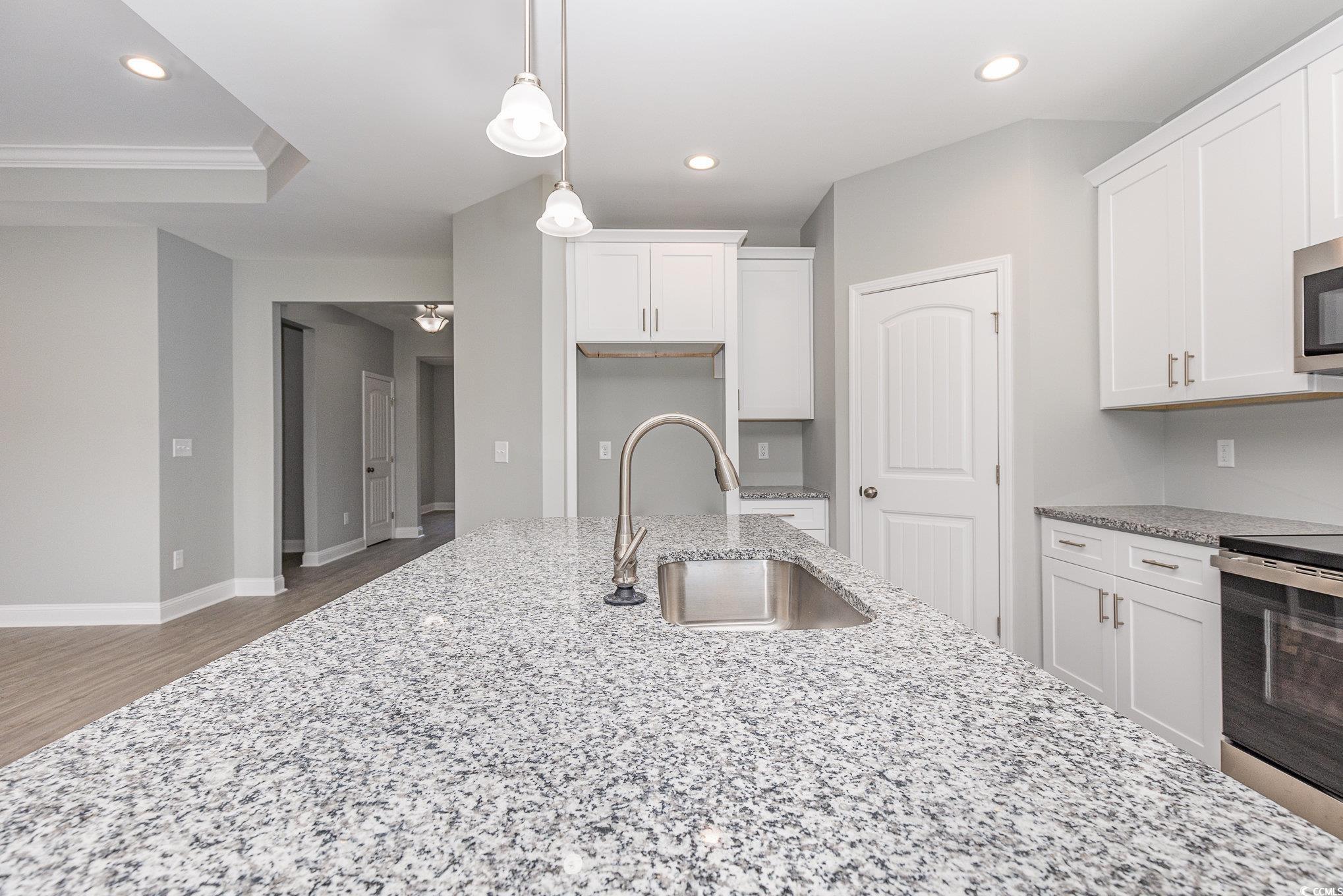 363 Log Cabin Road Loris, SC 29569 - Photo 11 of 30 Kitchen featuring white cabinetry, light stone cou