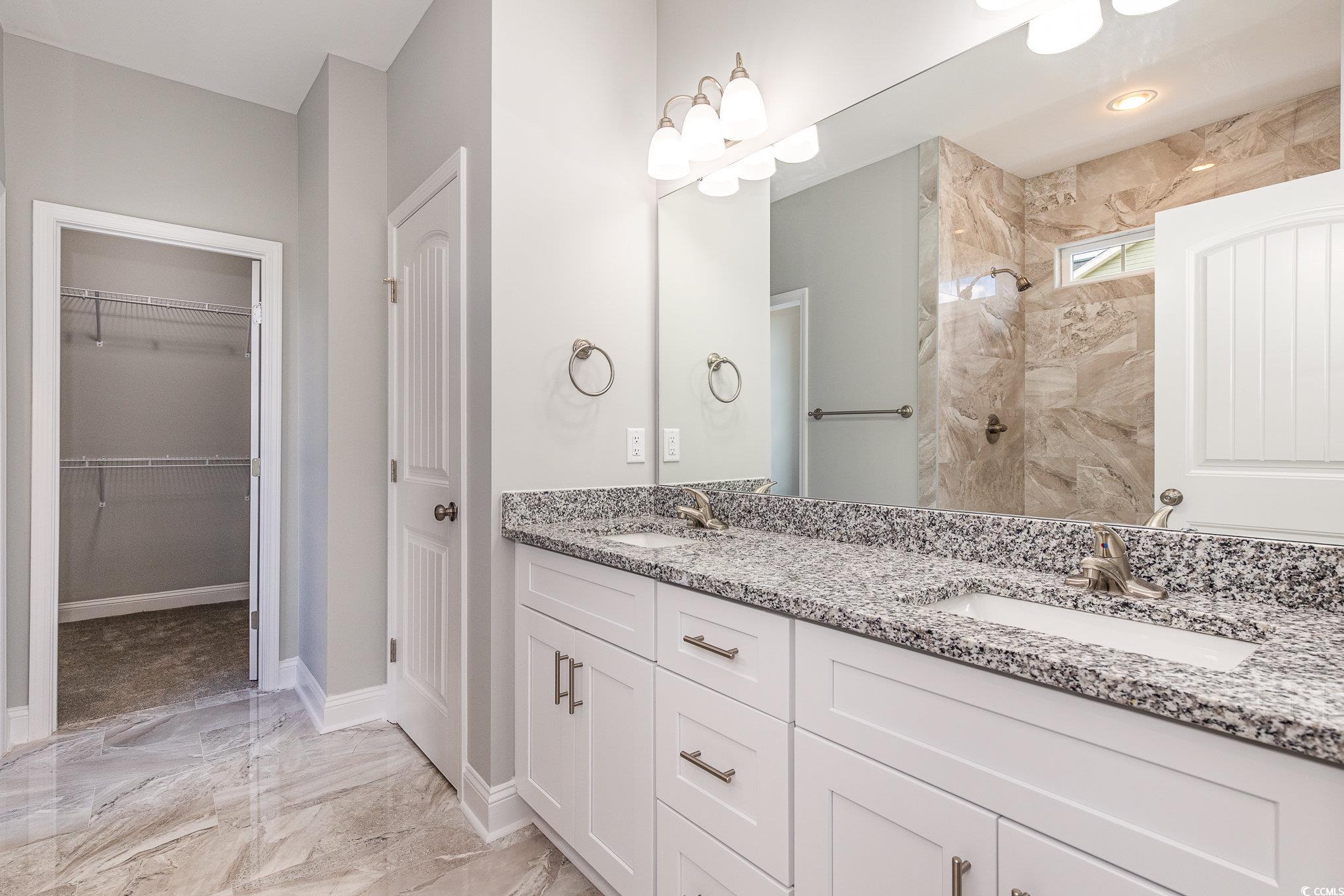 363 Log Cabin Road Loris, SC 29569 - Photo 19 of 30 Bathroom with vanity and tiled shower