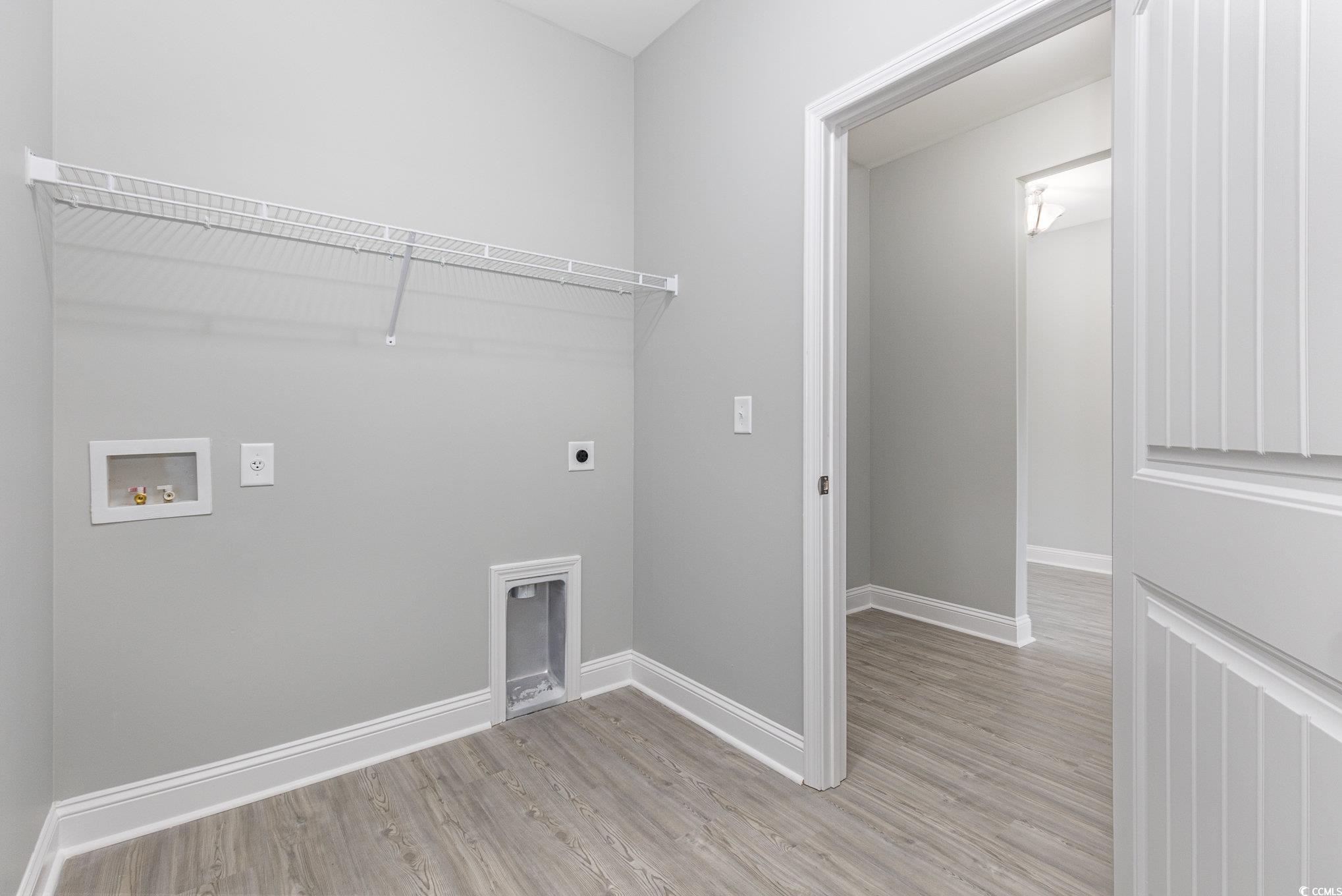 363 Log Cabin Road Loris, SC 29569 - Photo 22 of 30 Laundry room with washer hookup, light hardwood /