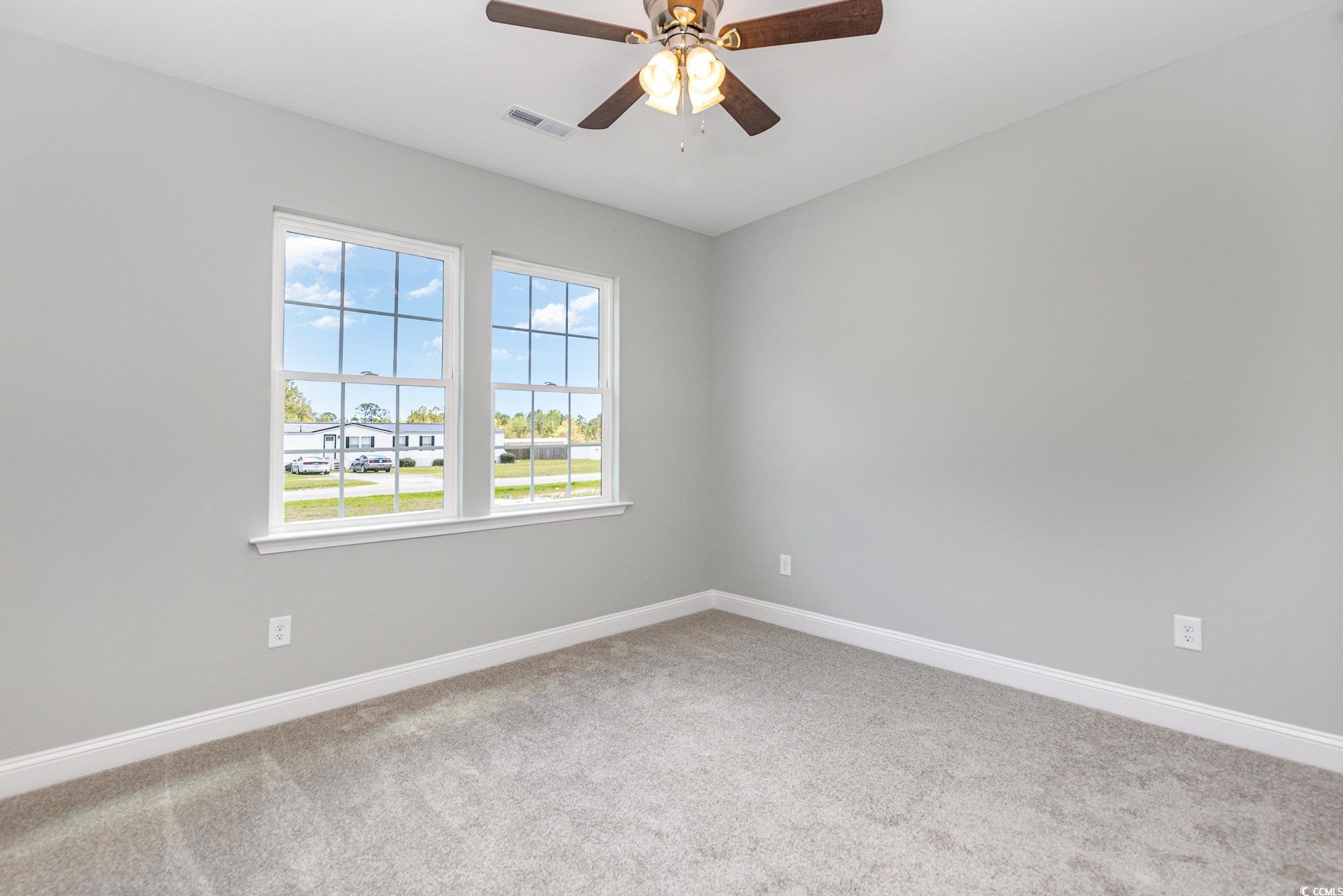 363 Log Cabin Road Loris, SC 29569 - Photo 24 of 30 Carpeted empty room featuring ceiling fan