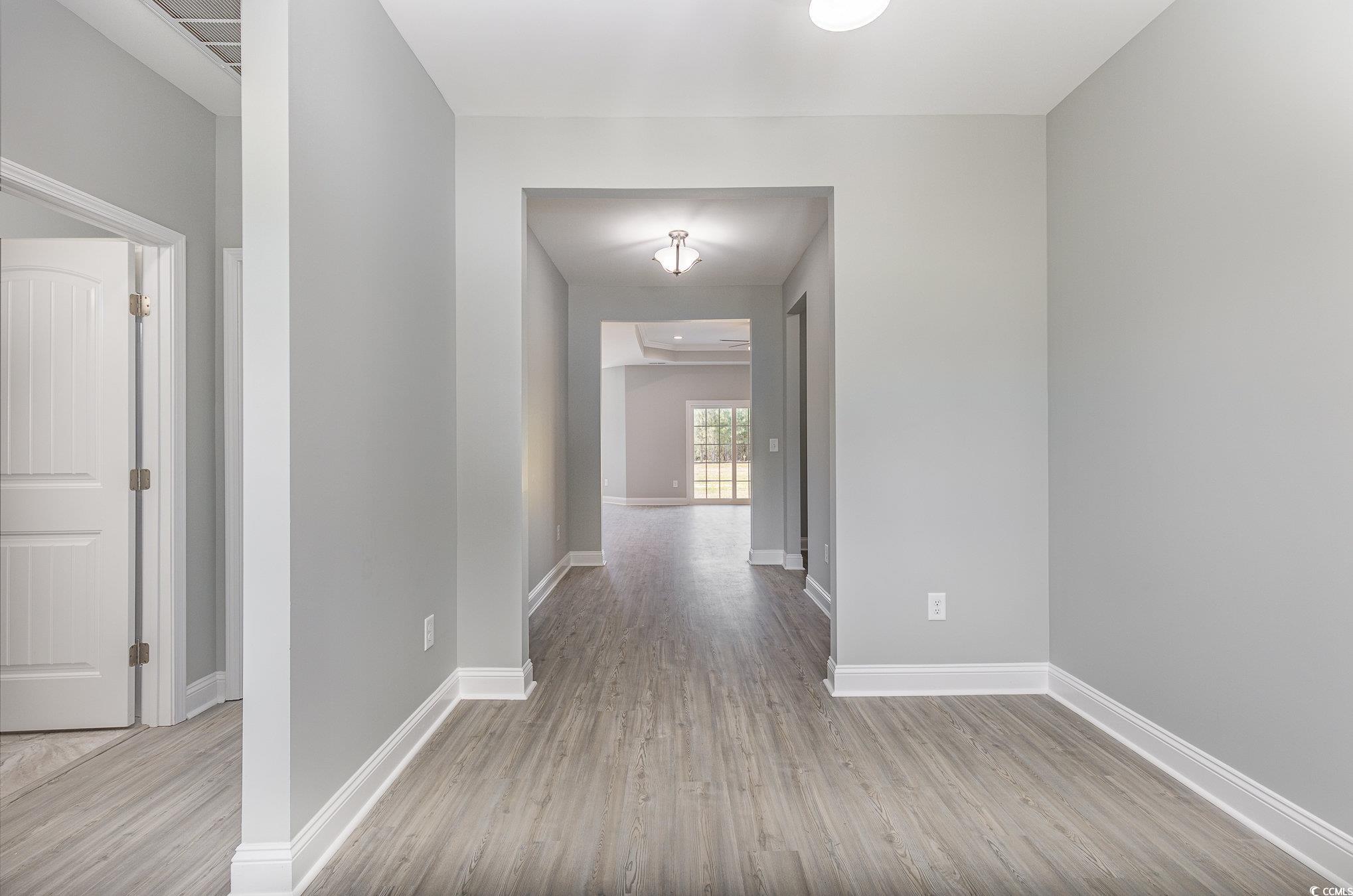 363 Log Cabin Road Loris, SC 29569 - Photo 3 of 30 Hallway featuring light hardwood / wood-style floo