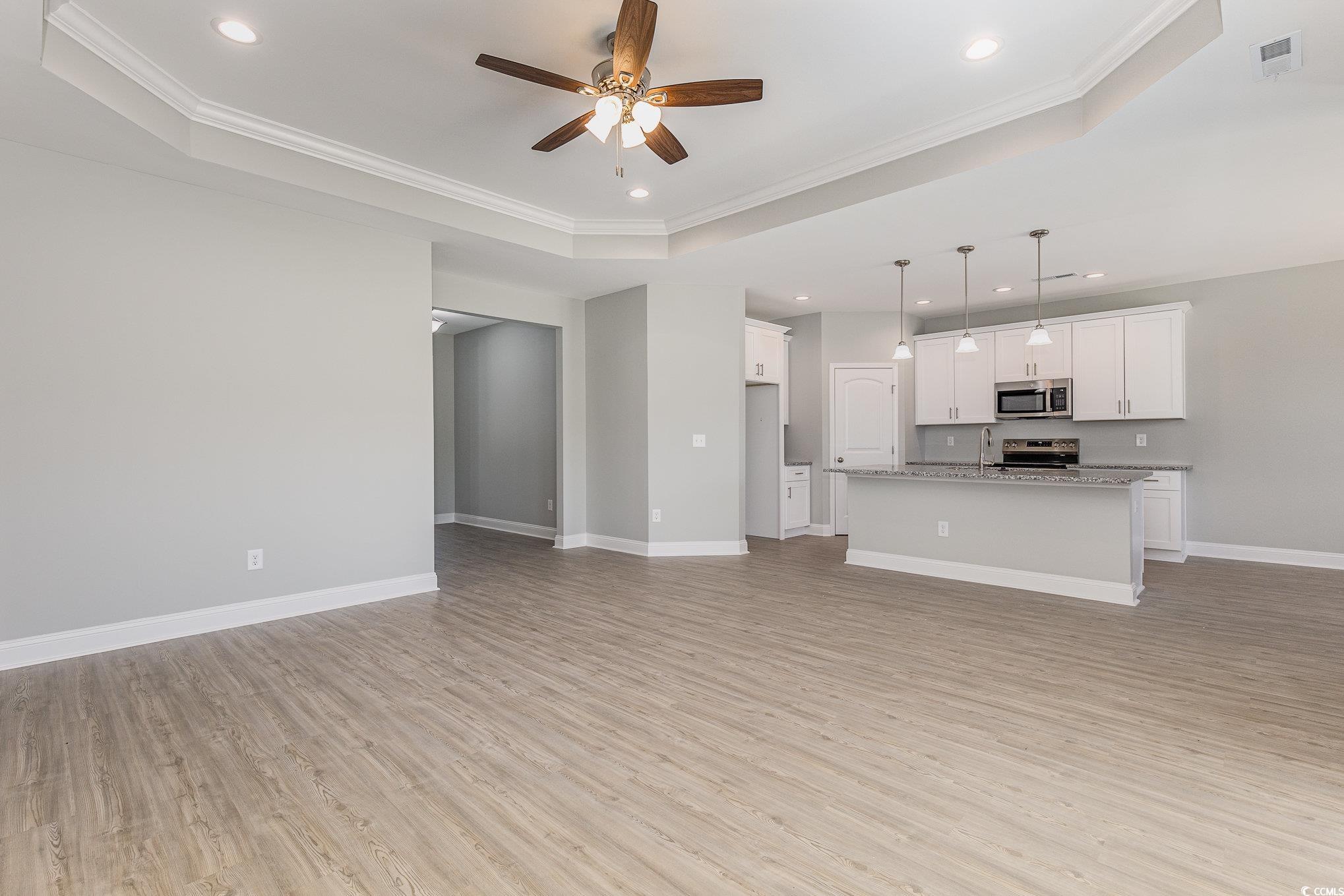 363 Log Cabin Road Loris, SC 29569 - Photo 5 of 30 Unfurnished living room with light wood-type floor