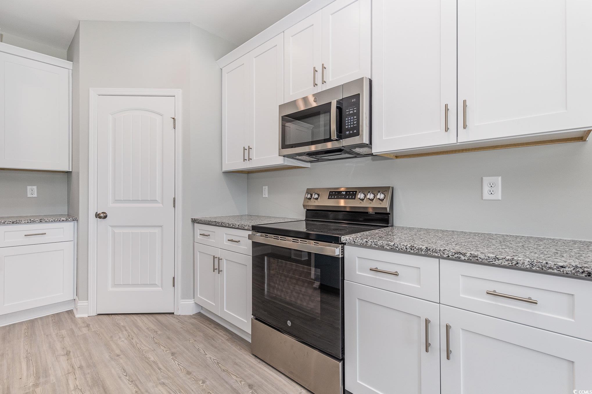 363 Log Cabin Road Loris, SC 29569 - Photo 8 of 30 Kitchen featuring light stone counters, appliances