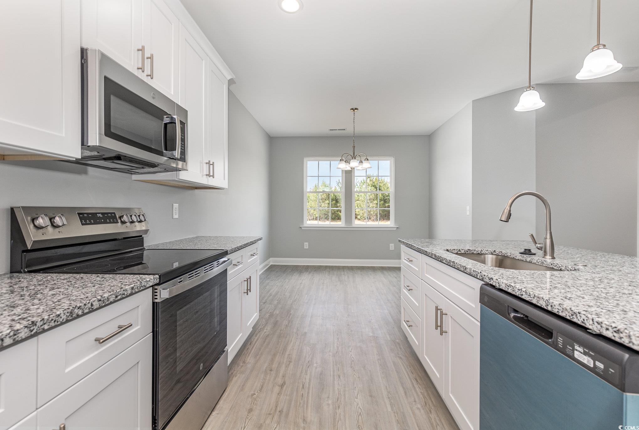 363 Log Cabin Road Loris, SC 29569 - Photo 9 of 30 Kitchen with stainless steel appliances, white cab