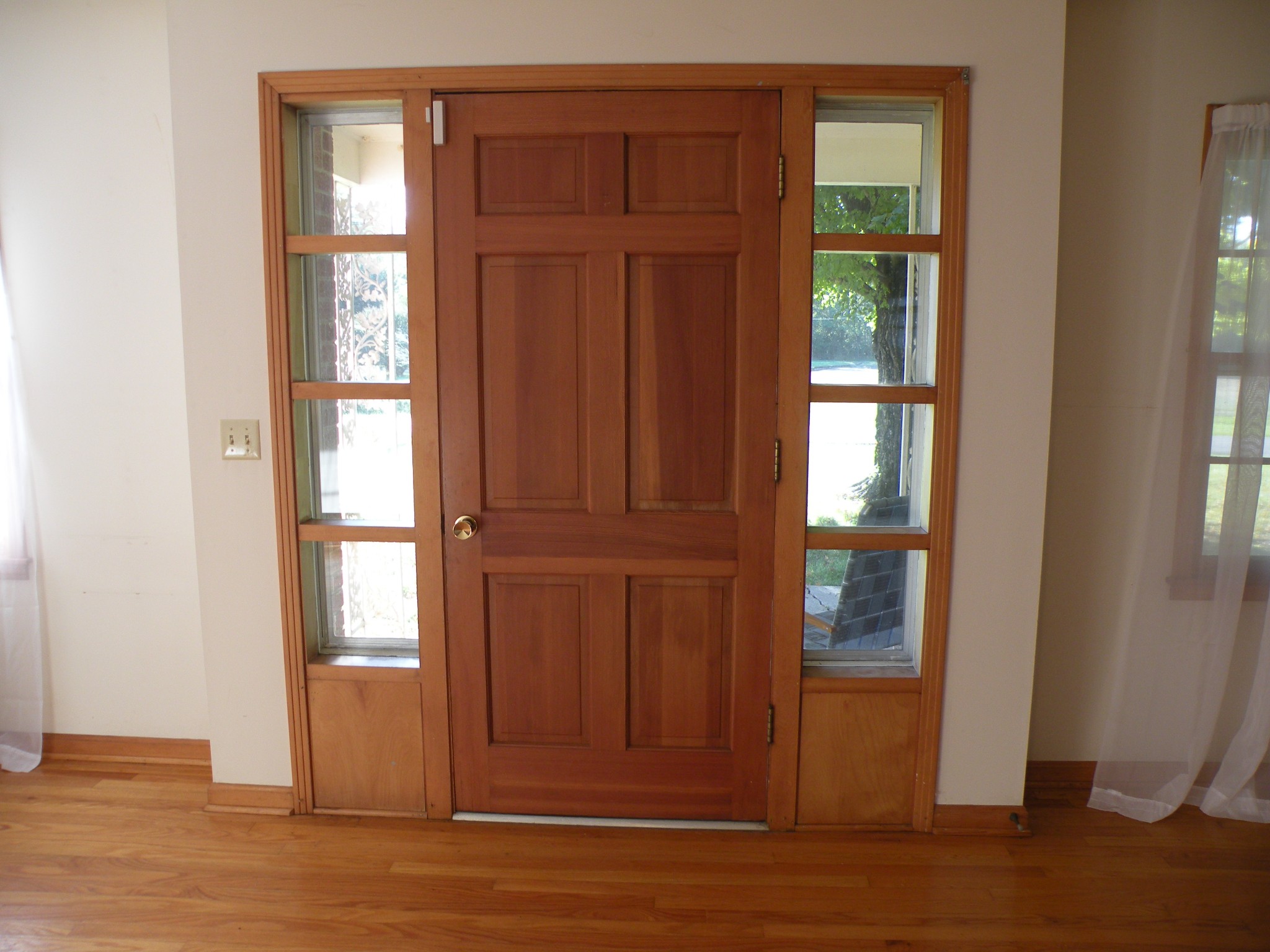 179 T G T Road Portland, TN 37148 - Photo 3 of 20 an empty room with wooden floor windows and front door