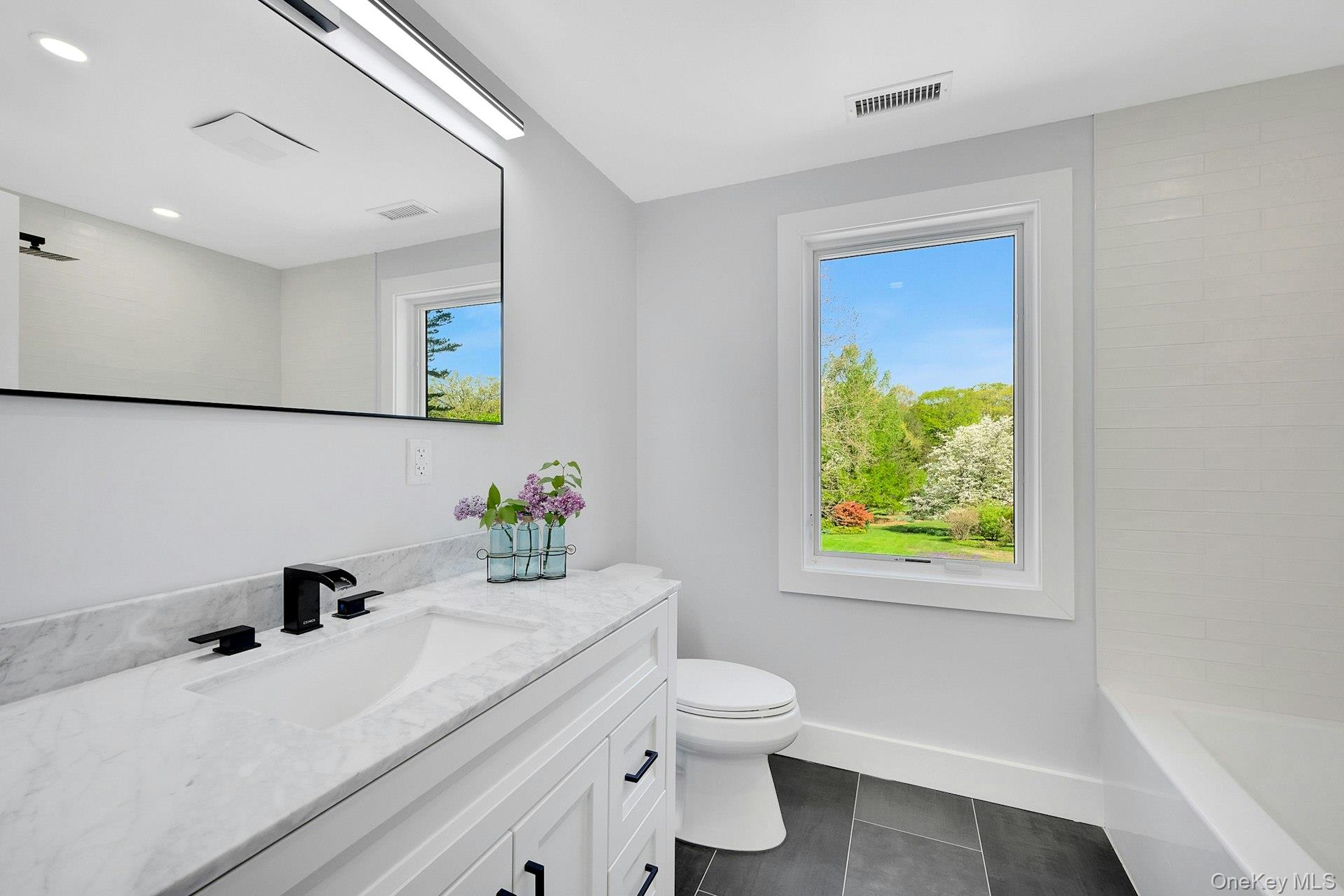 380 Cross River Road Katonah, NY 10536 - Photo 24 of 39 Bright and tastefully-decorated second floor bathroom