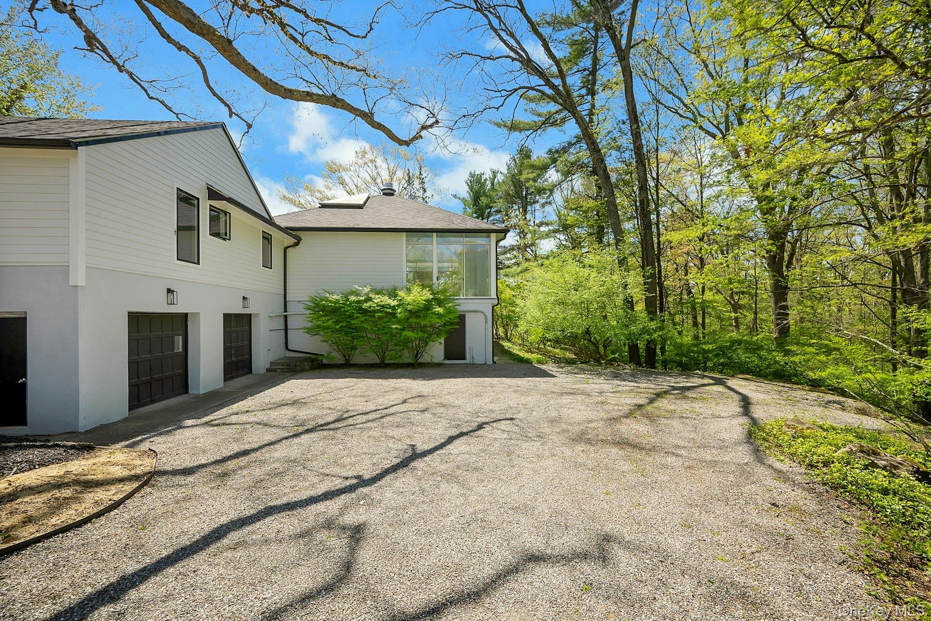 380 Cross River Road Katonah, NY 10536 - Photo 27 of 39 Two-car garage and view of pool enclosure