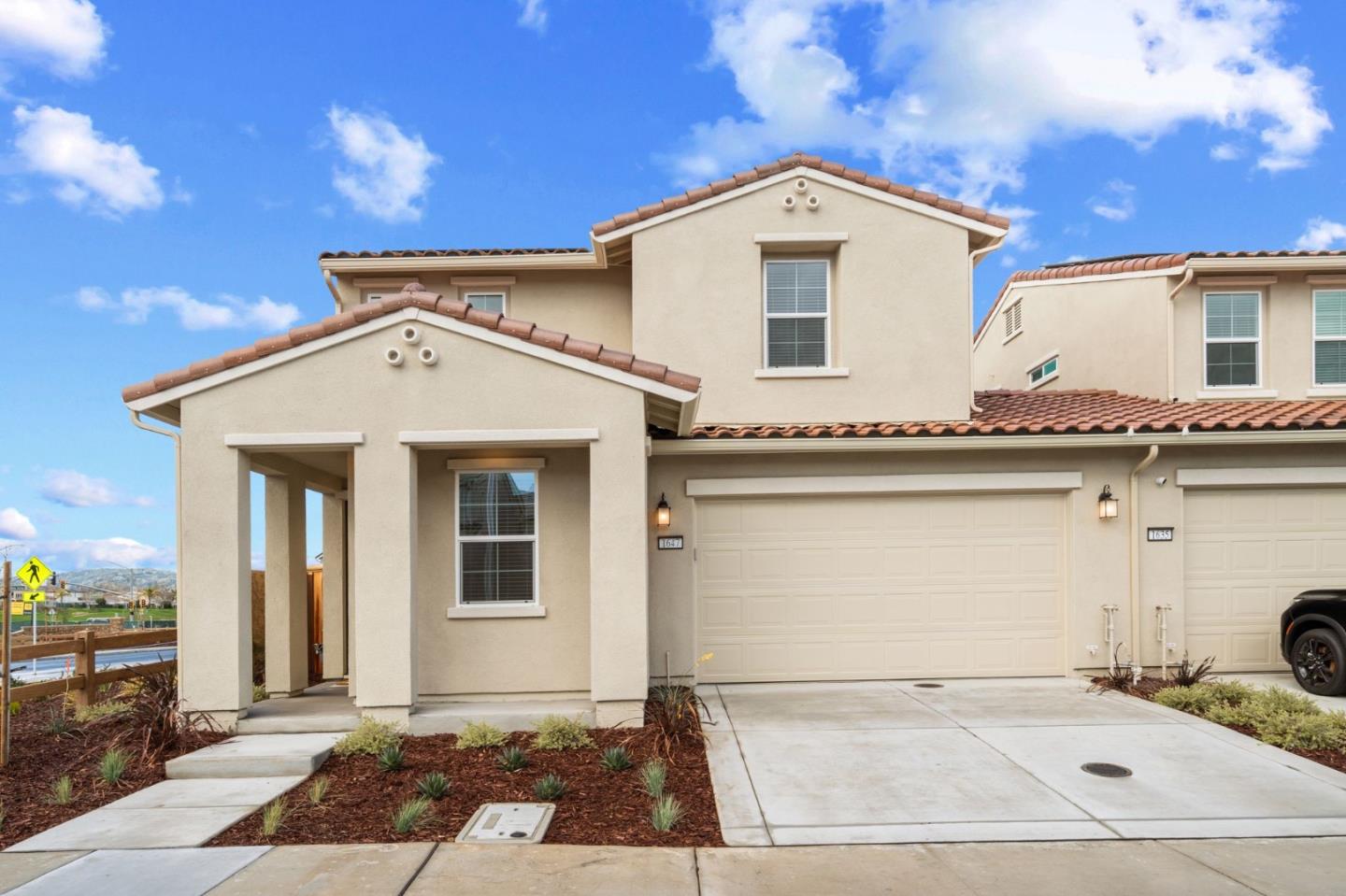 a front view of a house with a garage