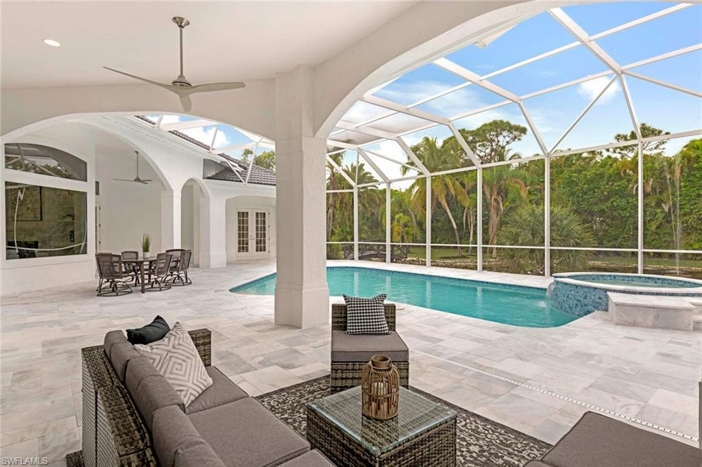 669 West Street Naples, FL 34108 - Photo 12 of 22 a view of a livingroom with furniture and window