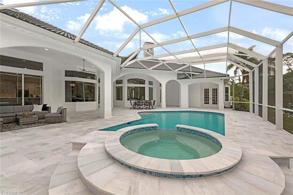 669 West Street Naples, FL 34108 - Photo 13 of 22 a view of a house with roof deck