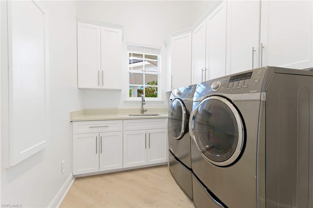 669 West Street Naples, FL 34108 - Photo 20 of 22 a utility room with sink dryer and washer