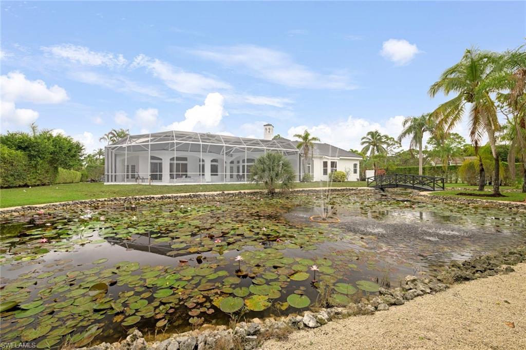 669 West Street Naples, FL 34108 - Photo 21 of 22 a view of a house with a yard