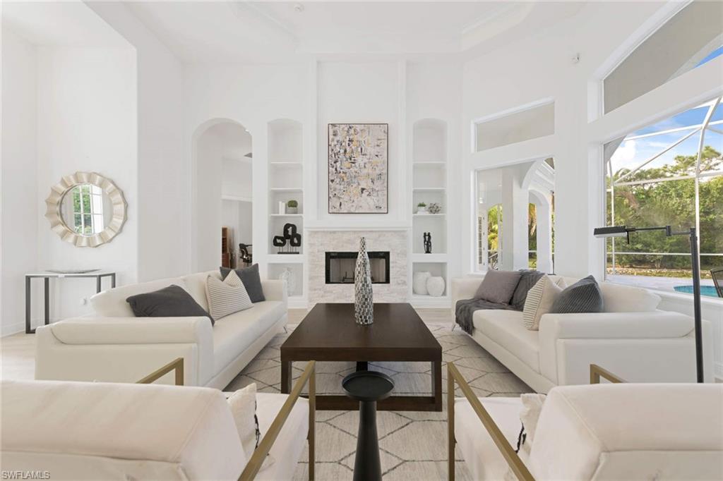 669 West Street Naples, FL 34108 - Photo 3 of 22 a living room with furniture and a large window