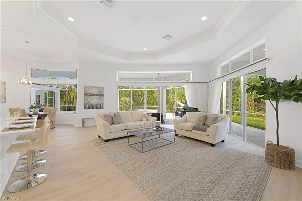 669 West Street Naples, FL 34108 - Photo 8 of 22 a living room with furniture and a large window