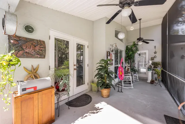 a view of a house with a swimming pool and sitting area