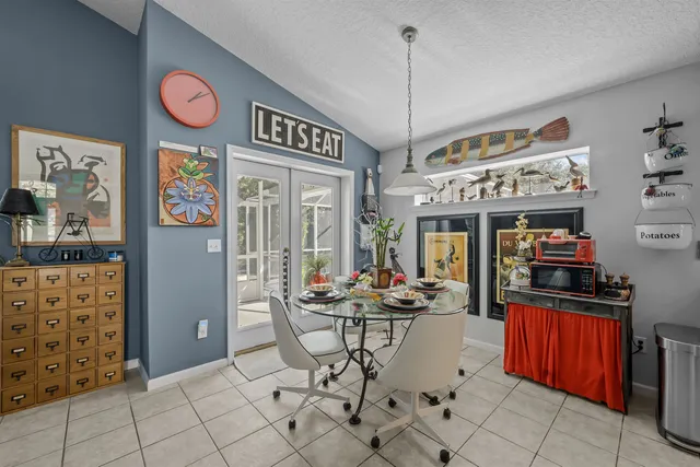 a view of a dining room with furniture wooden floor and window