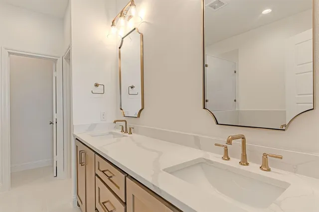 a spacious bedroom with a large bed and a window