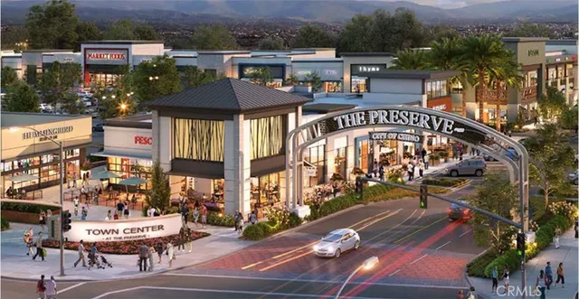 a en suite bathroom with a granite countertop sink and a mirror