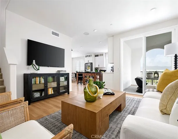 a view of a building with swimming pool and sitting area