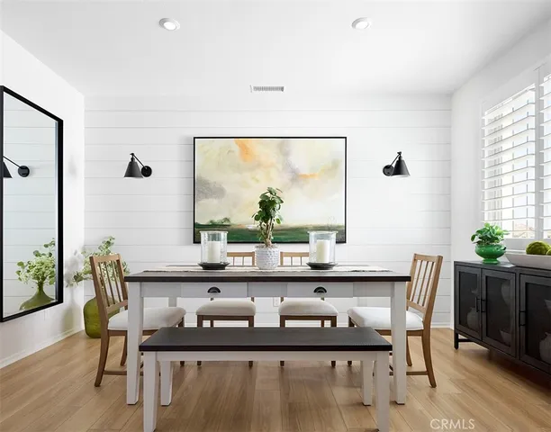 a living room with lots of furniture and a clock