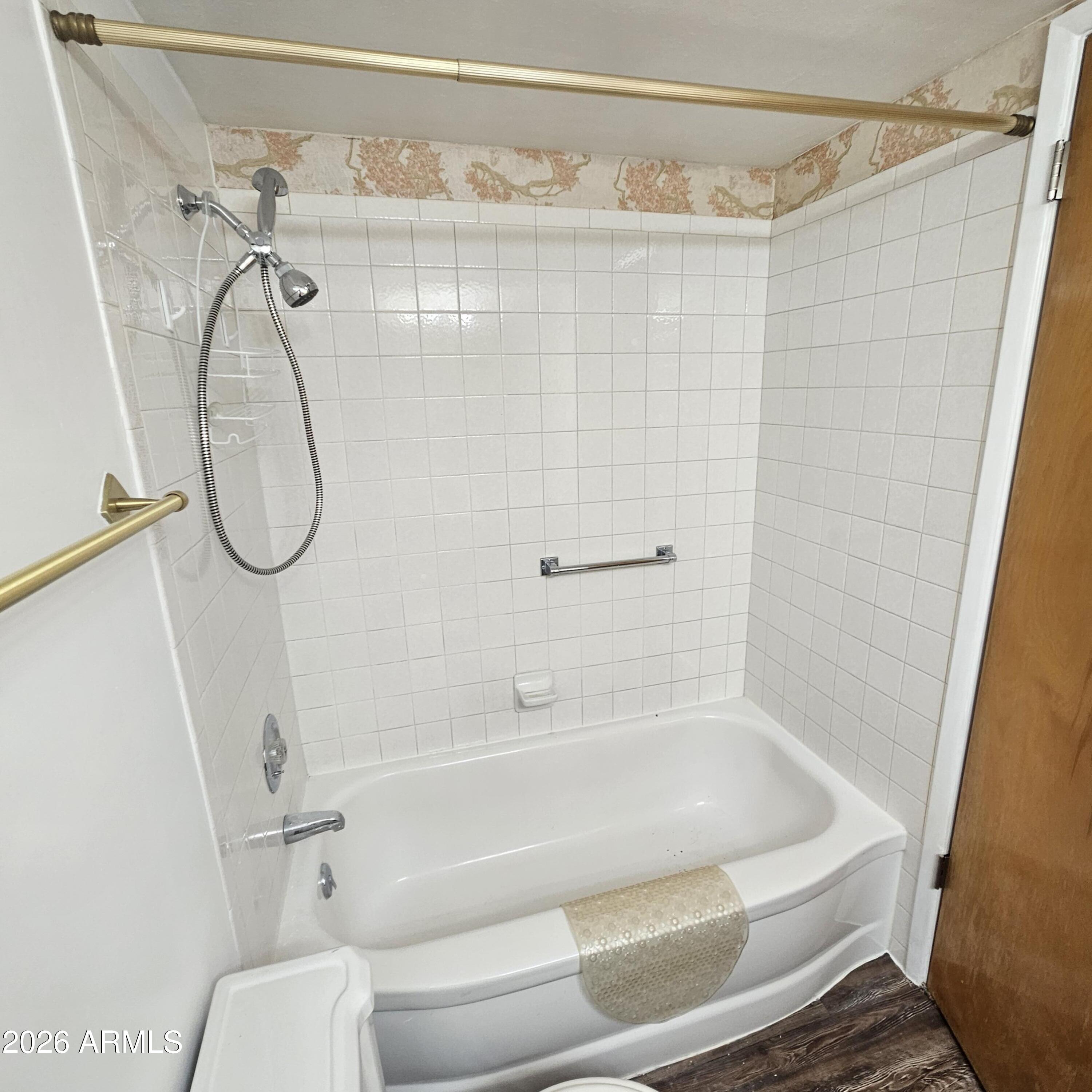 2575 West Berridge Lane, Unit D209 Phoenix, AZ 85017 - Photo 14 of 17 a bathroom with a bath tub with a shower