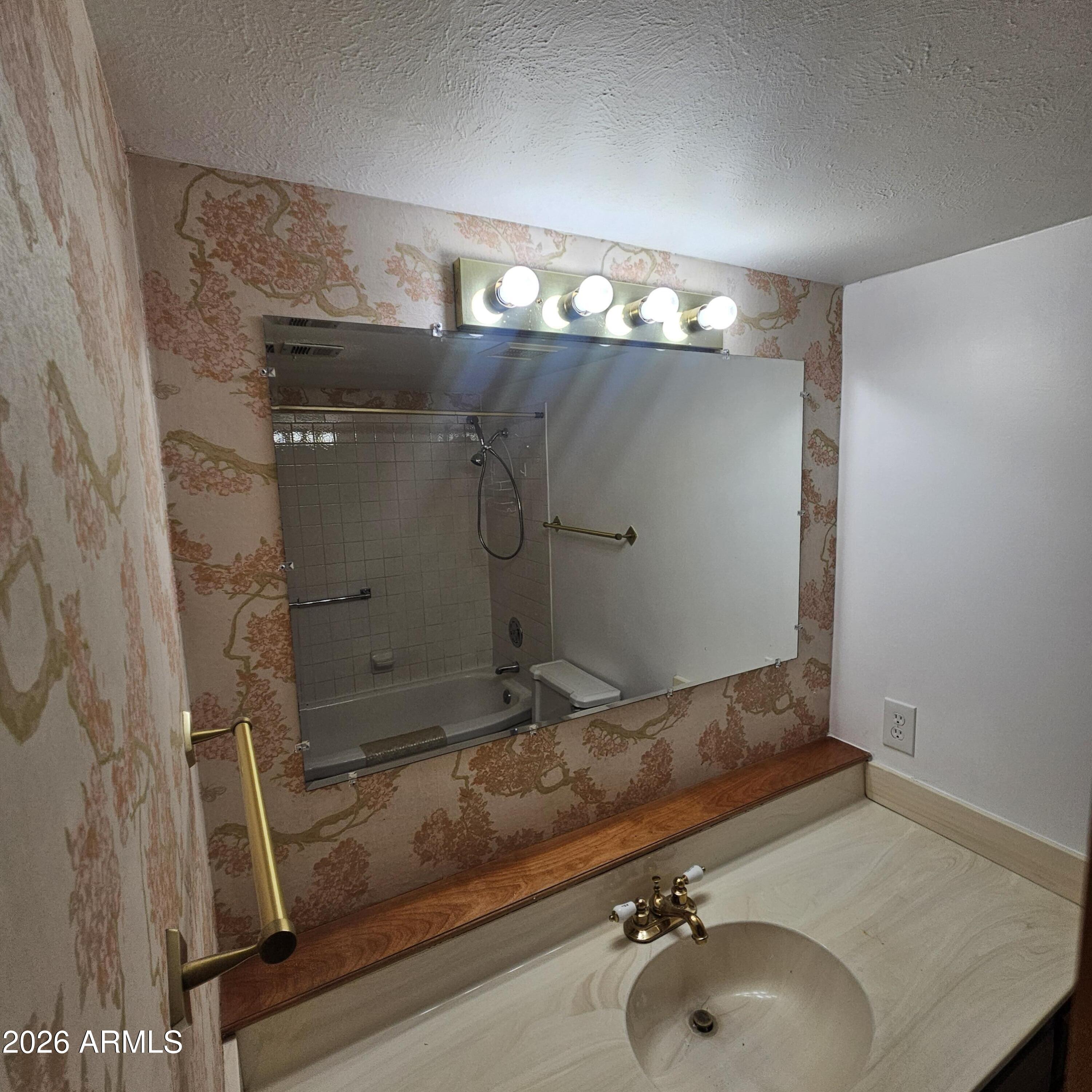 2575 West Berridge Lane, Unit D209 Phoenix, AZ 85017 - Photo 15 of 17 a bathroom with a sink and a mirror
