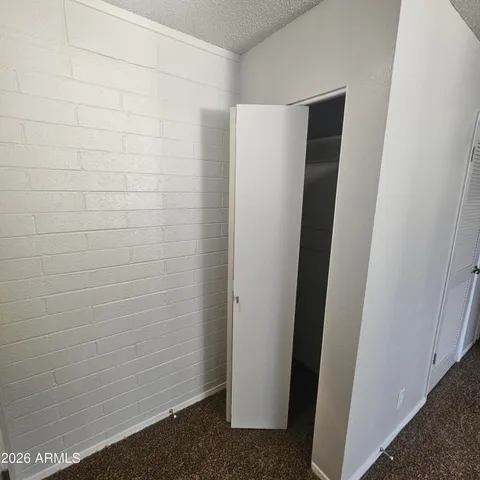 a bathroom with a shower and a door