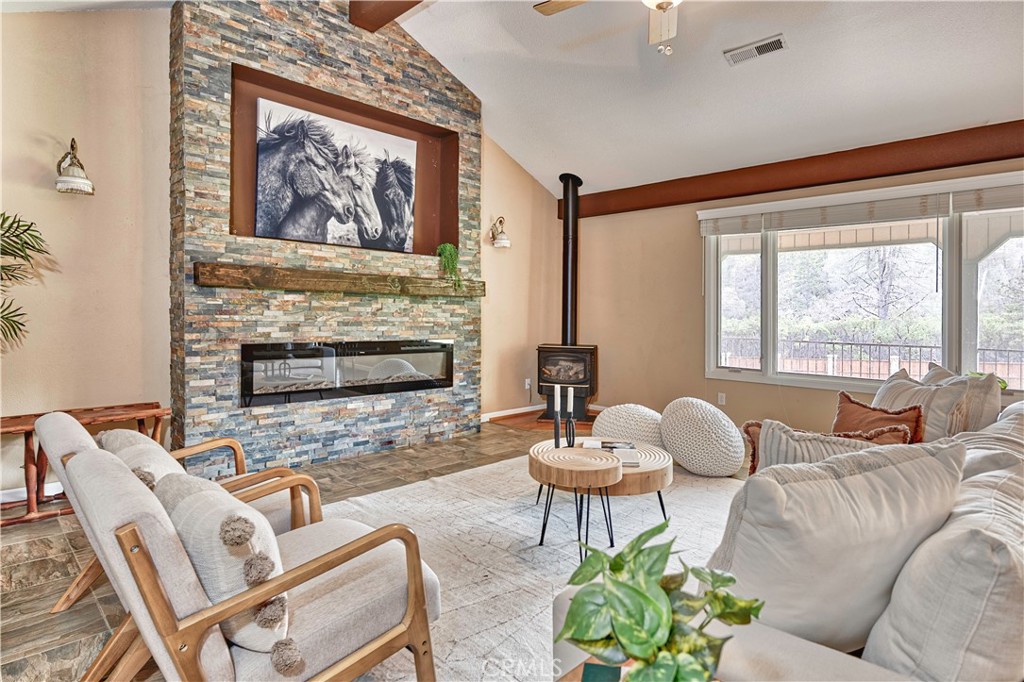 18501 Rustic Ridge Lower Lake, CA 95457 - Photo 13 of 46 a living room with furniture and a fireplace