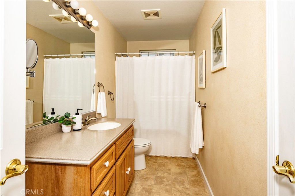 18501 Rustic Ridge Lower Lake, CA 95457 - Photo 26 of 46 a bathroom with a sink mirror and a shower