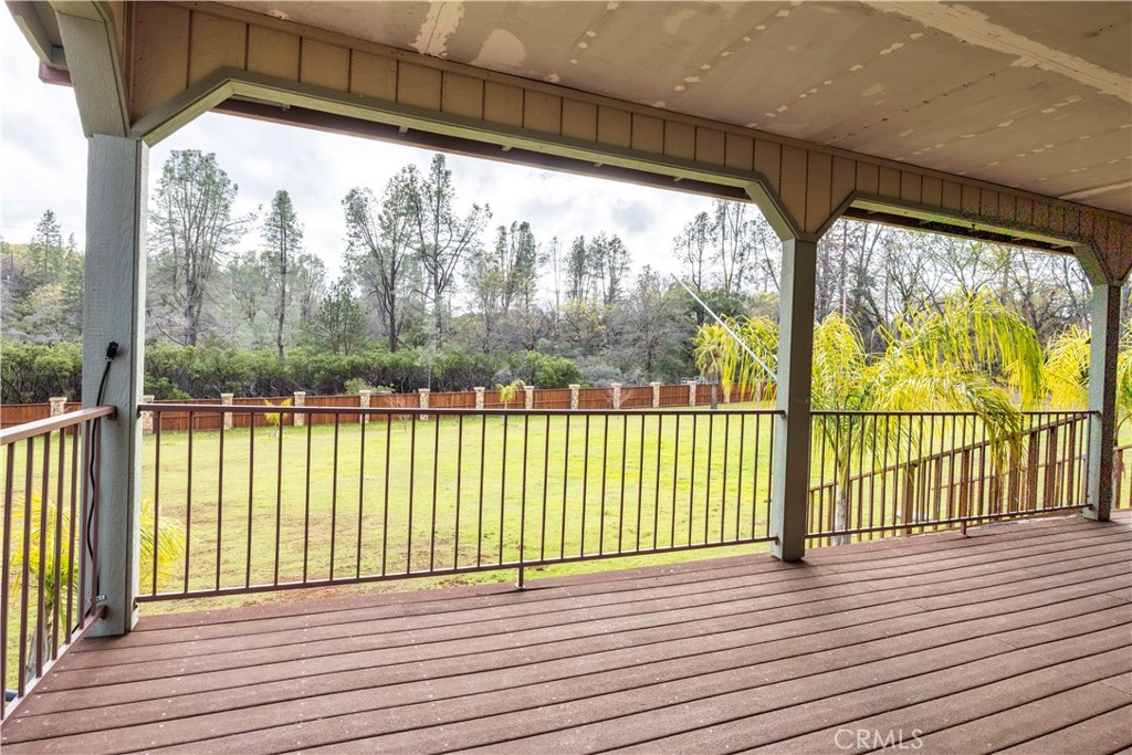 18501 Rustic Ridge Lower Lake, CA 95457 - Photo 31 of 46 a view of a porch with wooden floor and furniture