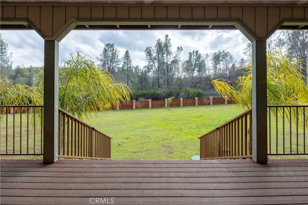 18501 Rustic Ridge Lower Lake, CA 95457 - Photo 33 of 46 a view of a balcony with floor to ceiling windows with wooden floor