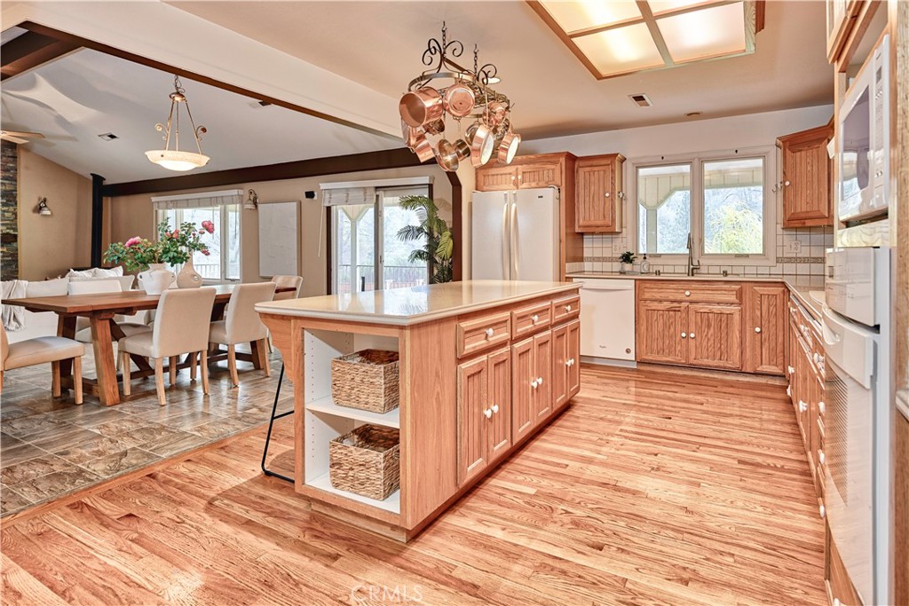 18501 Rustic Ridge Lower Lake, CA 95457 - Photo 6 of 46 a large kitchen with stainless steel appliances granite countertop a stove center island a dining table and chairs