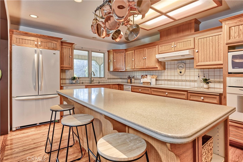 18501 Rustic Ridge Lower Lake, CA 95457 - Photo 7 of 46 a kitchen with stainless steel appliances granite countertop a sink a stove and a refrigerator