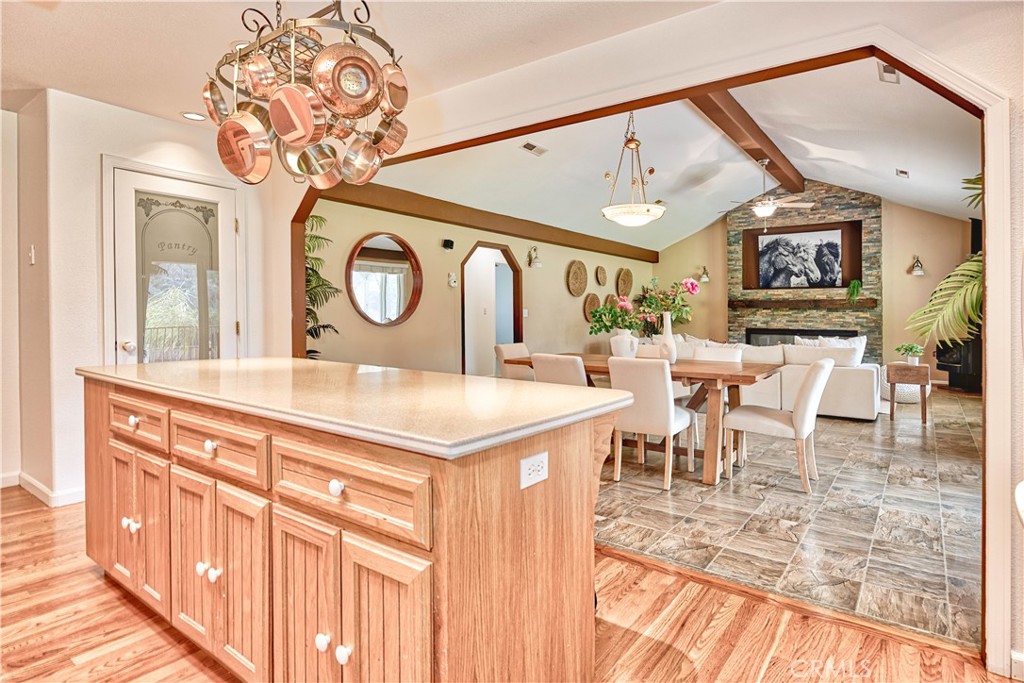 18501 Rustic Ridge Lower Lake, CA 95457 - Photo 9 of 46 a living room with furniture a dining table and a chandelier