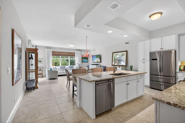 a view of hallway with wooden floor and a window