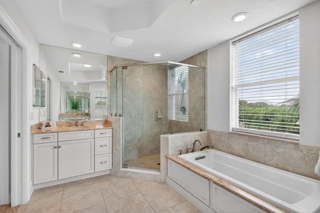 a bedroom with a bed a table and chair