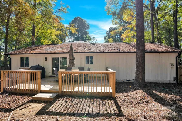 a kitchen with white cabinets and appliances