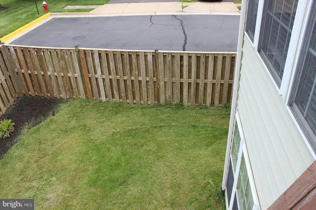 a balcony with wooden floor and outdoor space