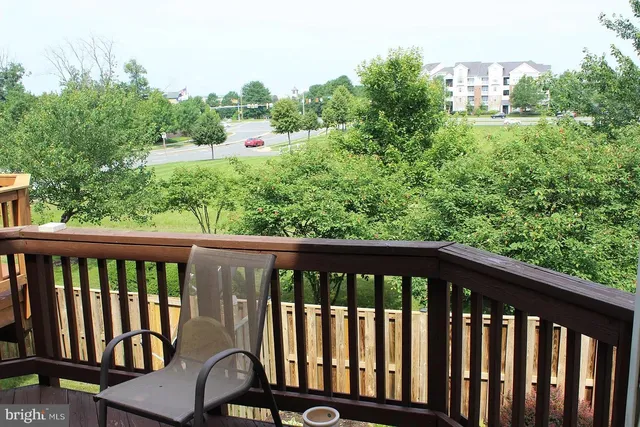 a view of a garden with wooden fence