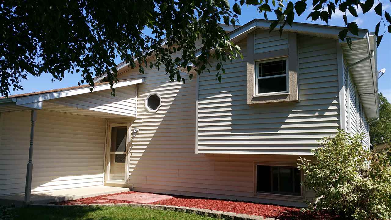 308 Pembroke Road Southwest Poplar Grove, IL 61065 - Photo 1 of 25 a view of a house with a yard