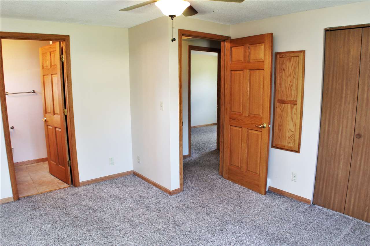 308 Pembroke Road Southwest Poplar Grove, IL 61065 - Photo 11 of 25 an empty room with windows