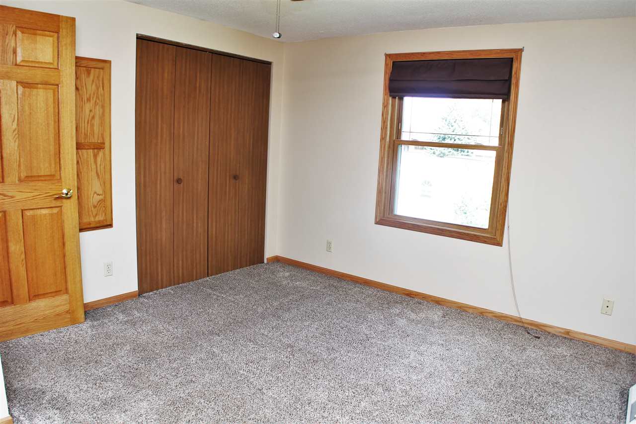308 Pembroke Road Southwest Poplar Grove, IL 61065 - Photo 12 of 25 an empty room with windows and closet