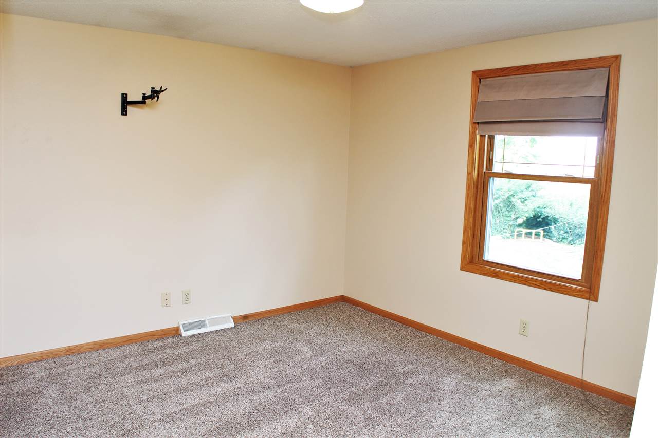 308 Pembroke Road Southwest Poplar Grove, IL 61065 - Photo 14 of 25 an empty room with a window